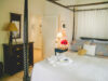 Inviting bedroom with four-poster bed and warm lighting at vacation rental st barts.