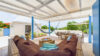 Shaded outdoor lounge with hammock and pool view at st barts villa rental.