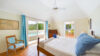 Bright bedroom with pool view and coastal décor at vacation rental st barts.