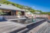 Contemporary villa with sleek infinity pool and wooden deck at private villa rentals st barts