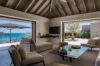 Elegant living room with open view to terrace and turquoise sea at luxury villa st barths.