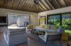 Bright living room with yellow accents and garden view at vacation rental st barts