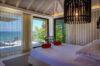 Seaside bedroom with terrace access and ocean view at luxury villa st barths
