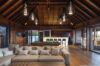 Elegant open-plan living room with bar and billiard table at st barts villa rental