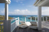 Sunlit terrace with lounge chairs and panoramic sea view at private villa st barths overlooking Flamands Bay.
