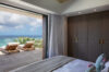 Ocean view bedroom with open terrace and sun loungers at private St Barts villa rental