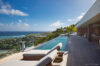 Infinity pool overlooking turquoise Caribbean waters from luxury St Barts villa rental in the hills of Colombier.