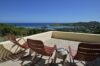 Panoramic ocean view and hilltop terrace evoke a sense of openness and tranquility