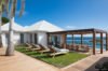 Ocean view terrace with sun loungers and shaded dining pergola, luxury villa rental in St Barts